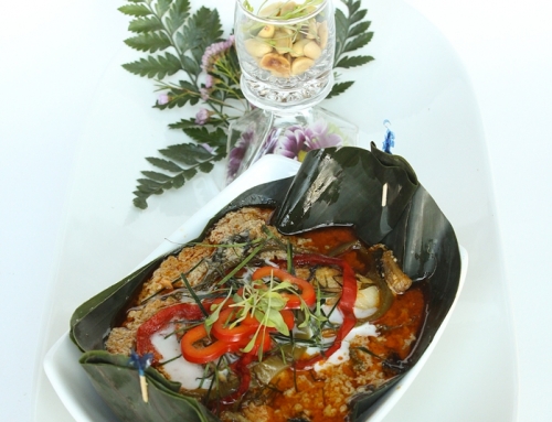 Steamed sea bass wrapped in a banana leaf with coconut milk